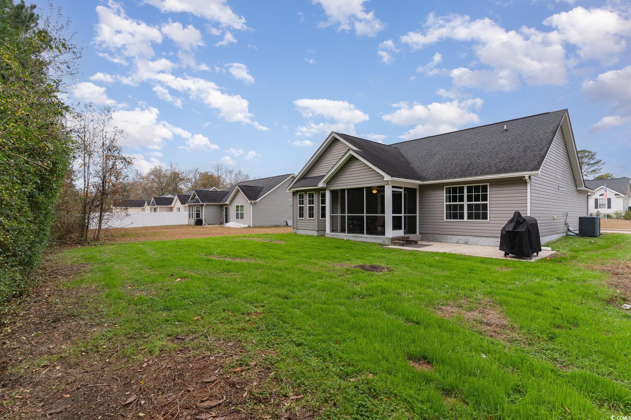 2432 Summerhaven Loop Conway, SC 29527 - Photo 33 of 40 Rear view of house featuring a patio area, a sunro