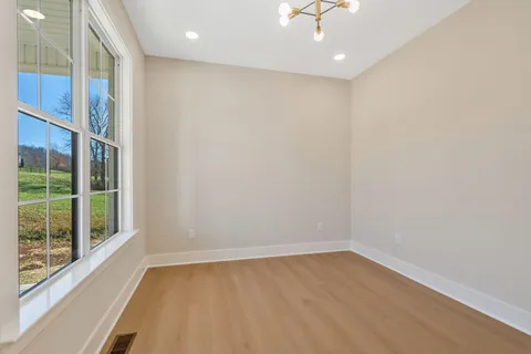 a view of an empty room with a window