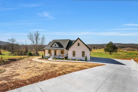 a view of swimming pool with an outdoor seating