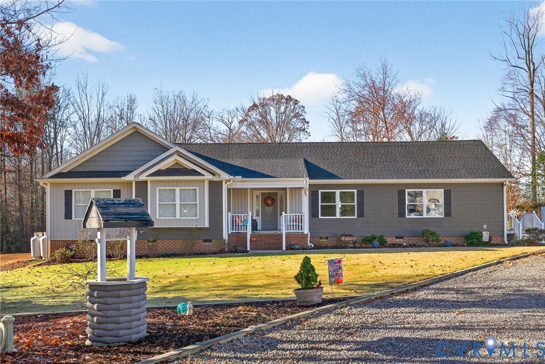 7844 Olivet Church Road New Kent, VA 23124 - Photo 12 of 43 a view of a house with a swimming pool and a yard