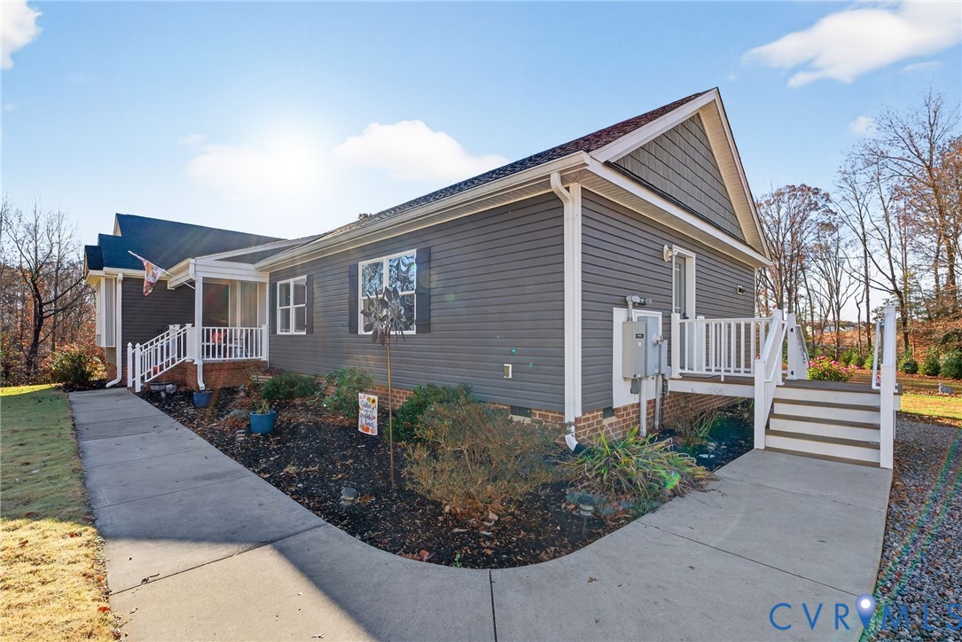 7844 Olivet Church Road New Kent, VA 23124 - Photo 14 of 43 a front view of a house with garden