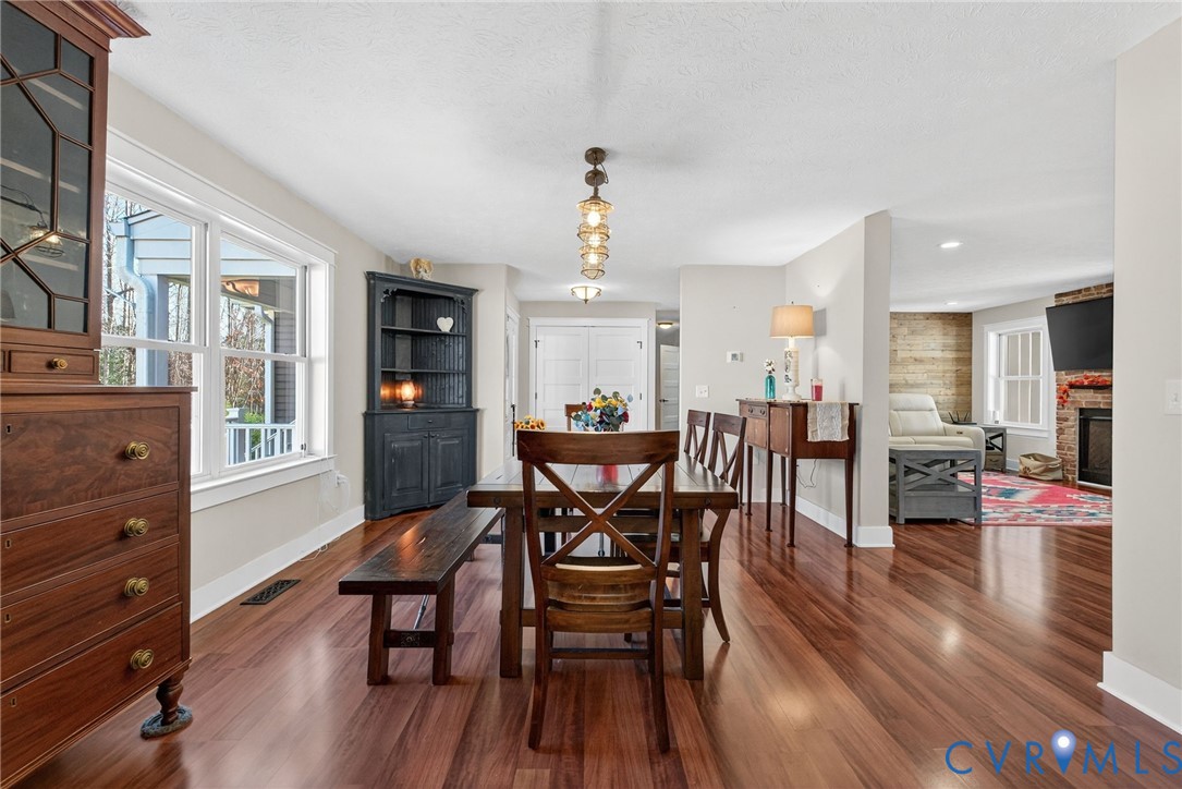 7844 Olivet Church Road New Kent, VA 23124 - Photo 15 of 43 a view of a dining room with furniture and wooden floor