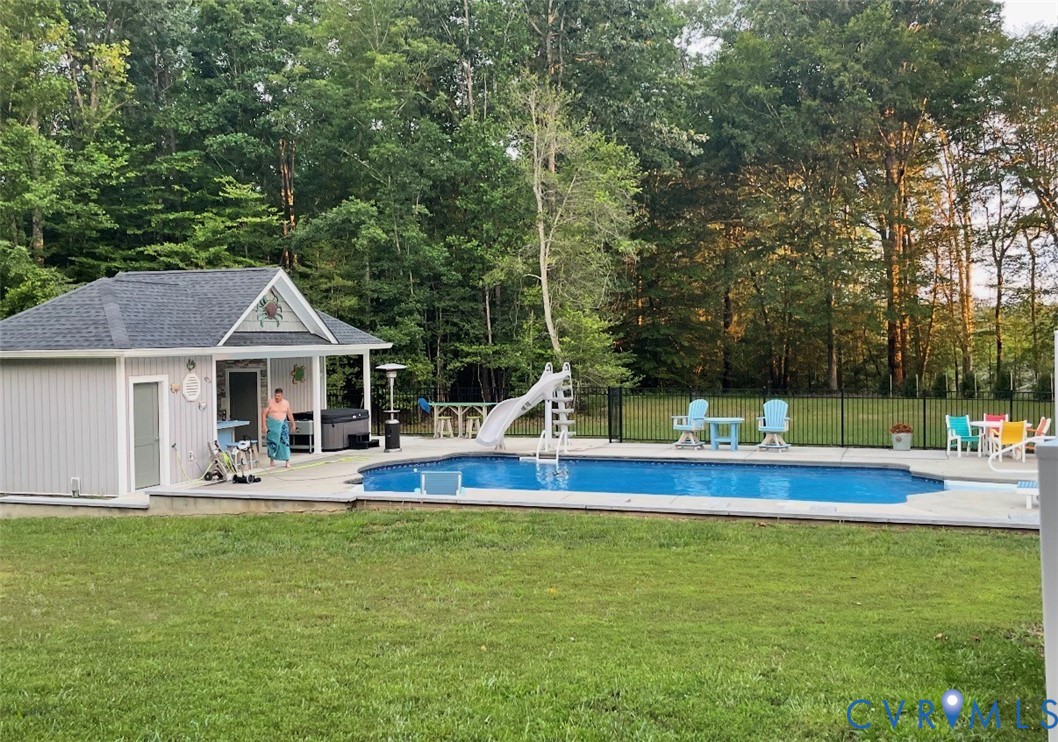 7844 Olivet Church Road New Kent, VA 23124 - Photo 23 of 43 View of pool featuring a water slide, an outbuildi