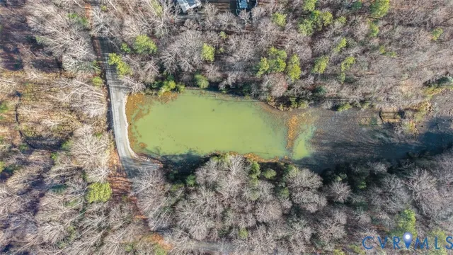a view of swimming pool with lounge chair under an umbrella