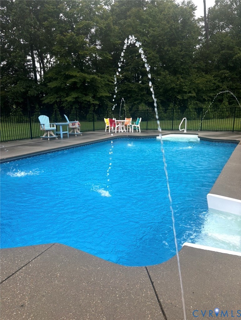 7844 Olivet Church Road New Kent, VA 23124 - Photo 4 of 43 a view of a swimming pool with a yard