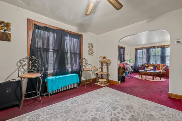 a bedroom with bed and window