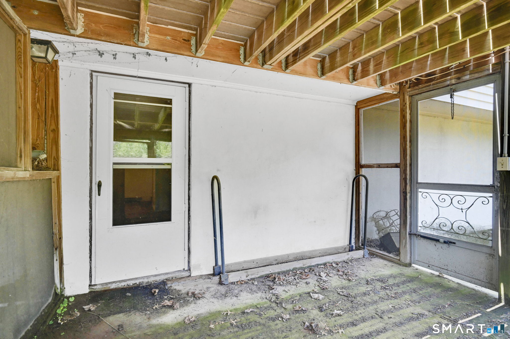 7 Rogers Drive Meriden, CT 06450 - Photo 34 of 40 a view of a porch with a door and a refrigerator