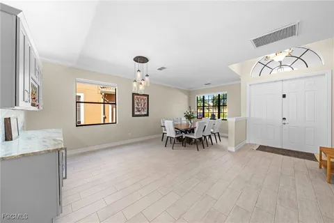 a view of dining room with furniture and chandelier