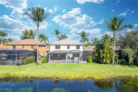 a front view of house with yard and outdoor seating
