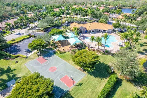 an aerial view of a house with a swimming pool yard and outdoor seating
