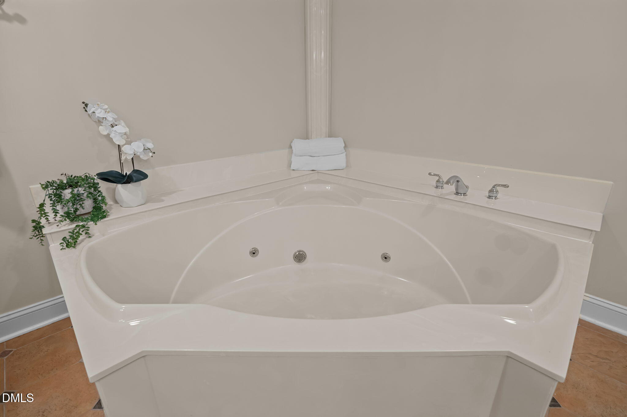 6423 New Market Way Raleigh, NC 27615 - Photo 14 of 33 a white bath tub sitting in a bathroom