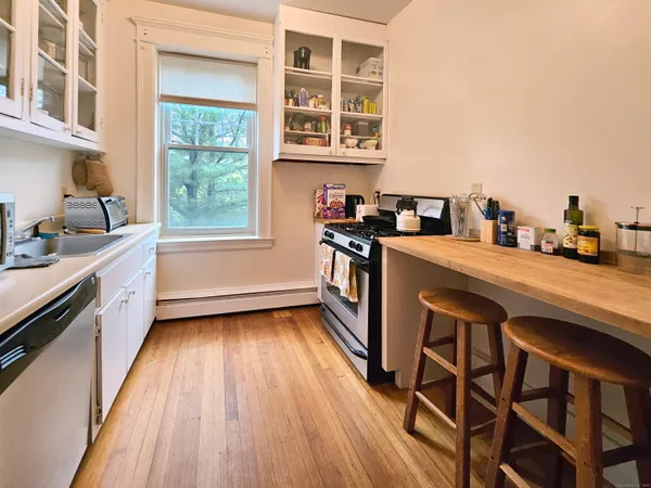 a kitchen with a sink a window and appliances