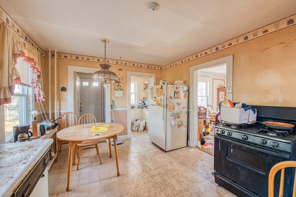 3 Crescent Road Needham, MA 02494 - Photo 11 of 15 a large kitchen with a table and chairs