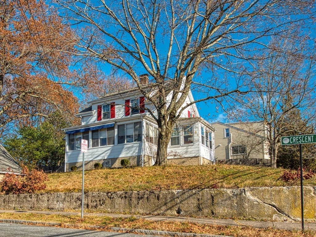 3 Crescent Road Needham, MA 02494 - Photo 2 of 15 a front view of a house with a yard