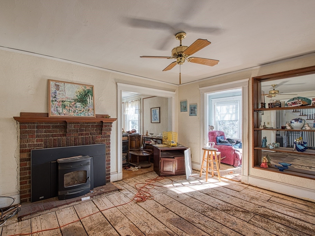 3 Crescent Road Needham, MA 02494 - Photo 7 of 15 a living room with furniture and a fireplace