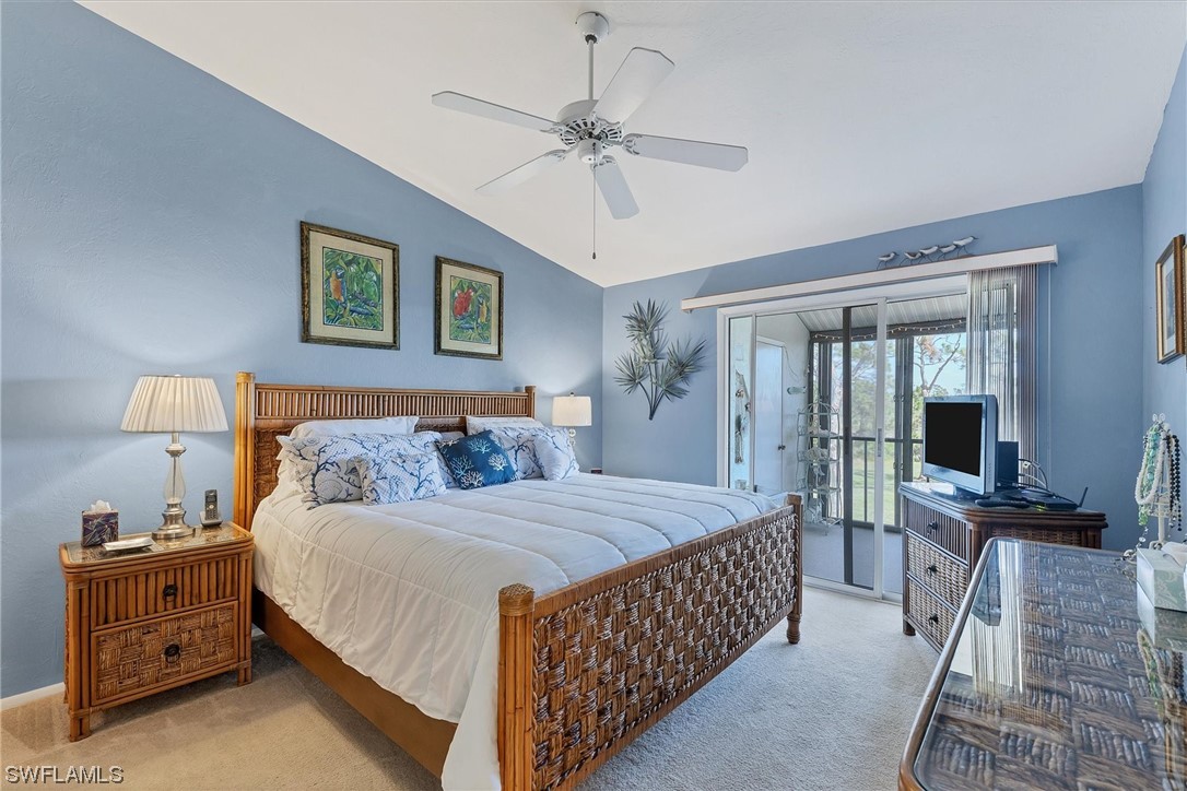 6800 Placida Road, Unit 2002 Englewood, FL 34224 - Photo 18 of 25 a bedroom with a bed and a chandelier