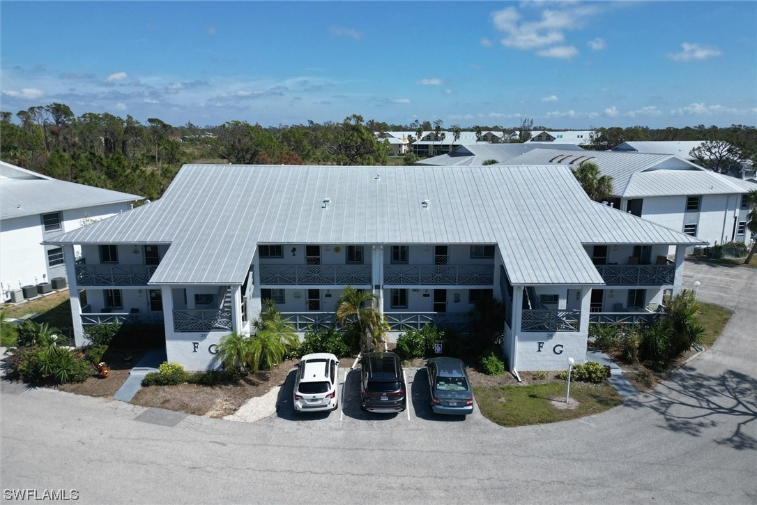6800 Placida Road, Unit 2002 Englewood, FL 34224 - Photo 2 of 25 an aerial view of a house with sitting area and garden
