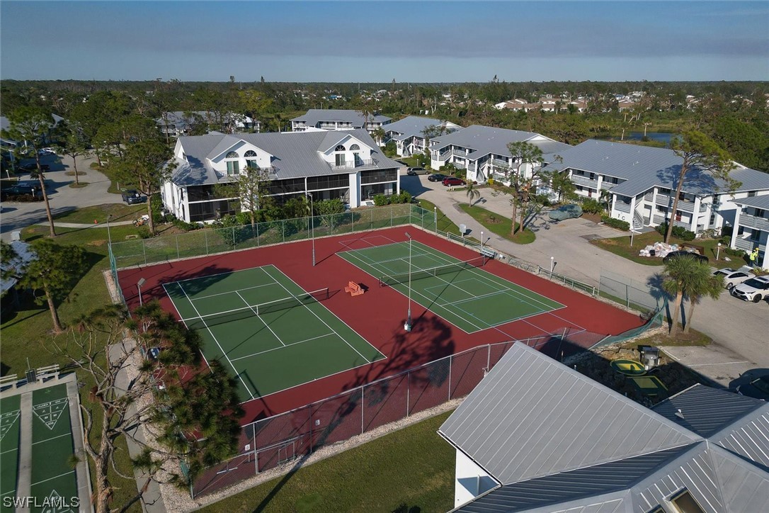 6800 Placida Road, Unit 2002 Englewood, FL 34224 - Photo 24 of 25 an aerial view of a tennis ground and a building in the background