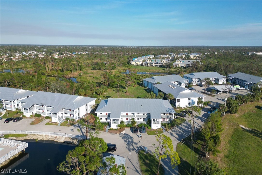 6800 Placida Road, Unit 2002 Englewood, FL 34224 - Photo 3 of 25 an aerial view of a city with lots of residential buildings