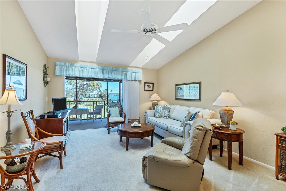 6800 Placida Road, Unit 2002 Englewood, FL 34224 - Photo 6 of 25 a living room with furniture and a window