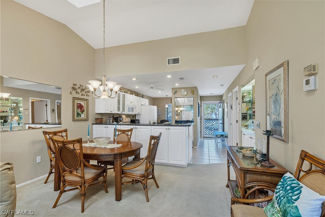 6800 Placida Road, Unit 2002 Englewood, FL 34224 - Photo 9 of 25 a view of a dining room with furniture