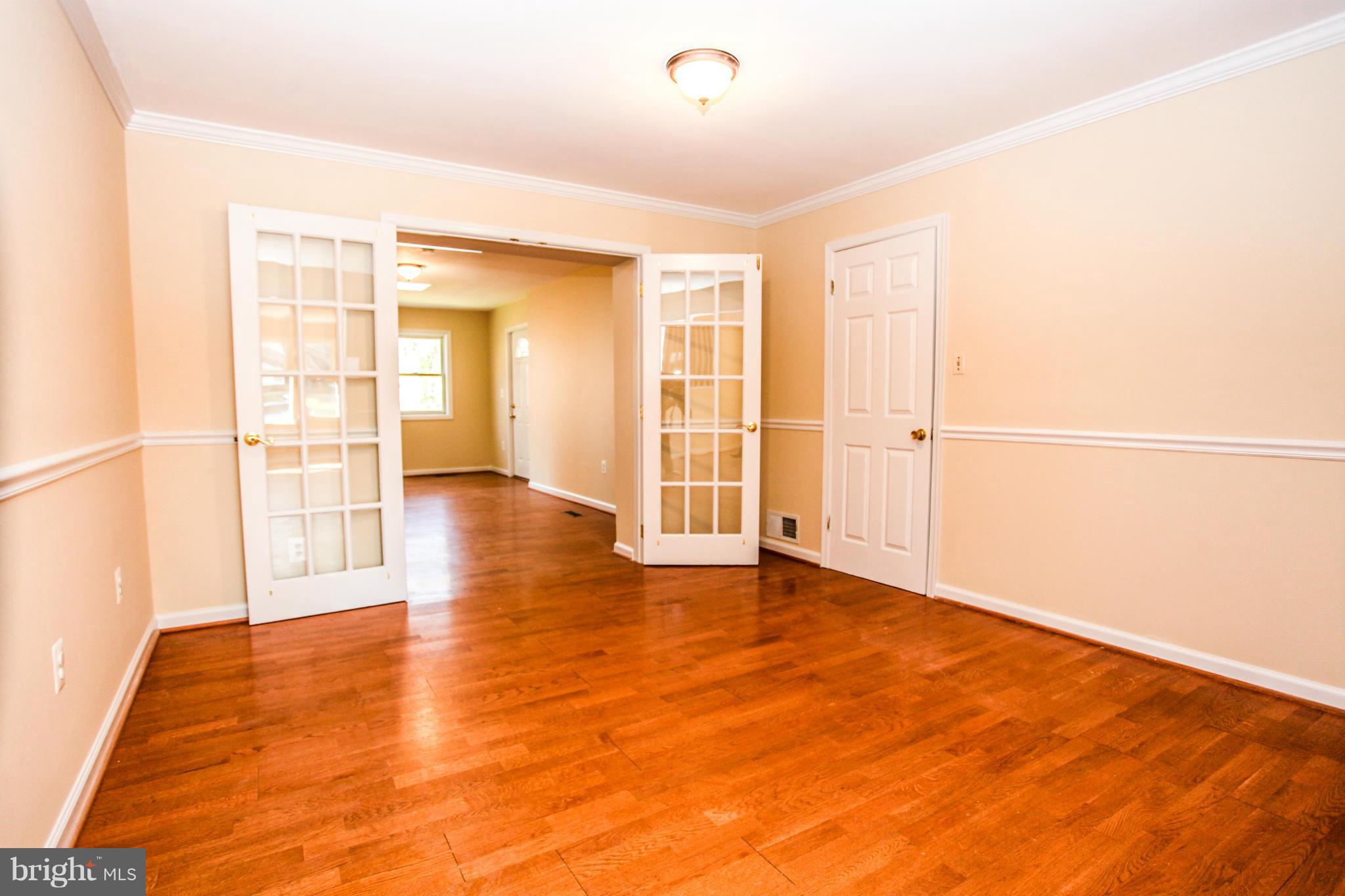 7620 Dunston Street Springfield, VA 22151 - Photo 11 of 24 a view of an empty room with glass door