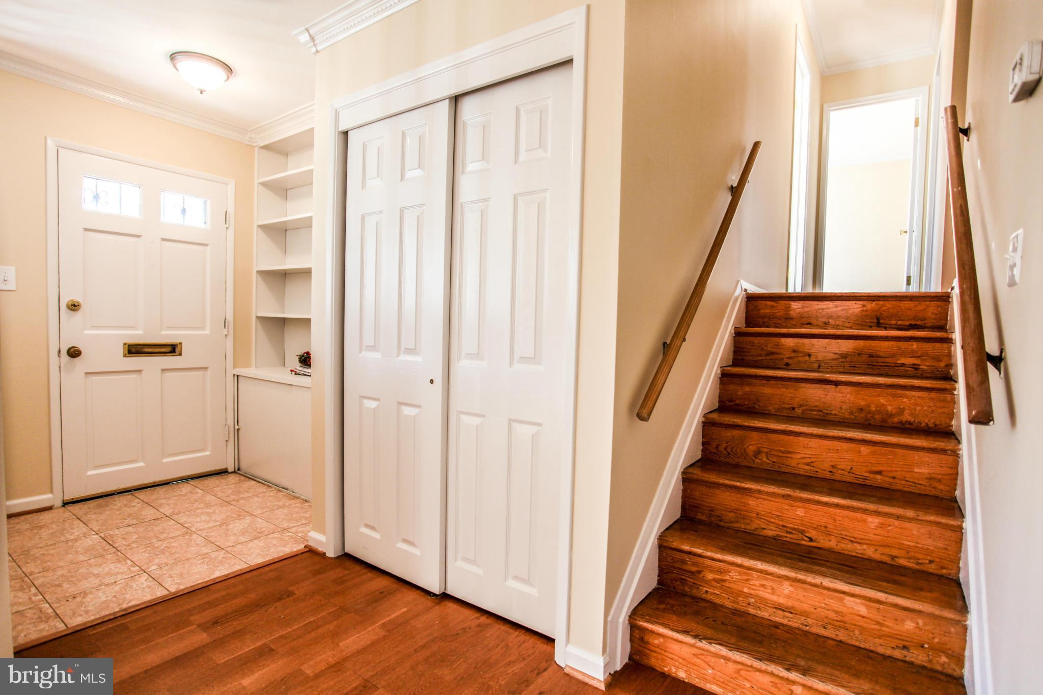 7620 Dunston Street Springfield, VA 22151 - Photo 12 of 24 a view of entryway with wooden floor and staircase