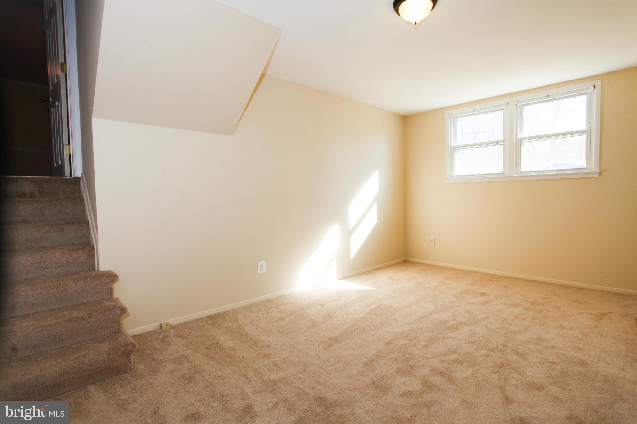 7620 Dunston Street Springfield, VA 22151 - Photo 15 of 24 a view of an empty room with a window
