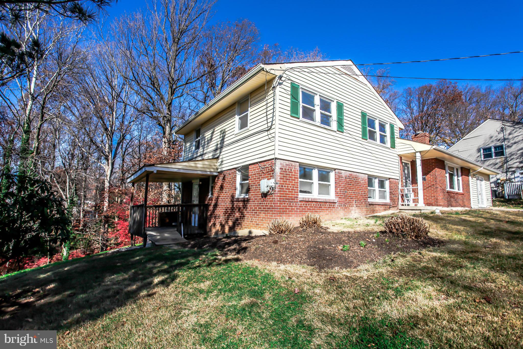 7620 Dunston Street Springfield, VA 22151 - Photo 2 of 24 a front view of a house with a yard