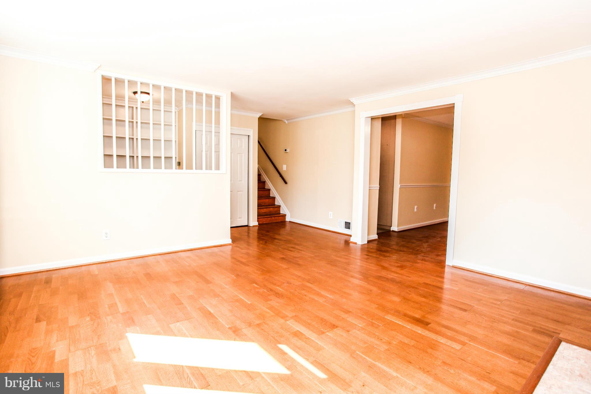 7620 Dunston Street Springfield, VA 22151 - Photo 4 of 24 a view of an empty room with wooden floor