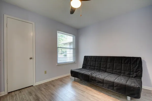 a living room with a couch and a window