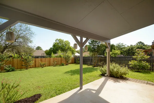 a view of a backyard with a lake view