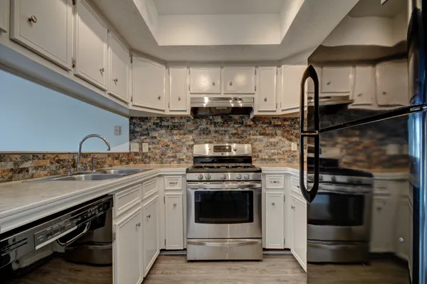 a kitchen with a stove and a sink