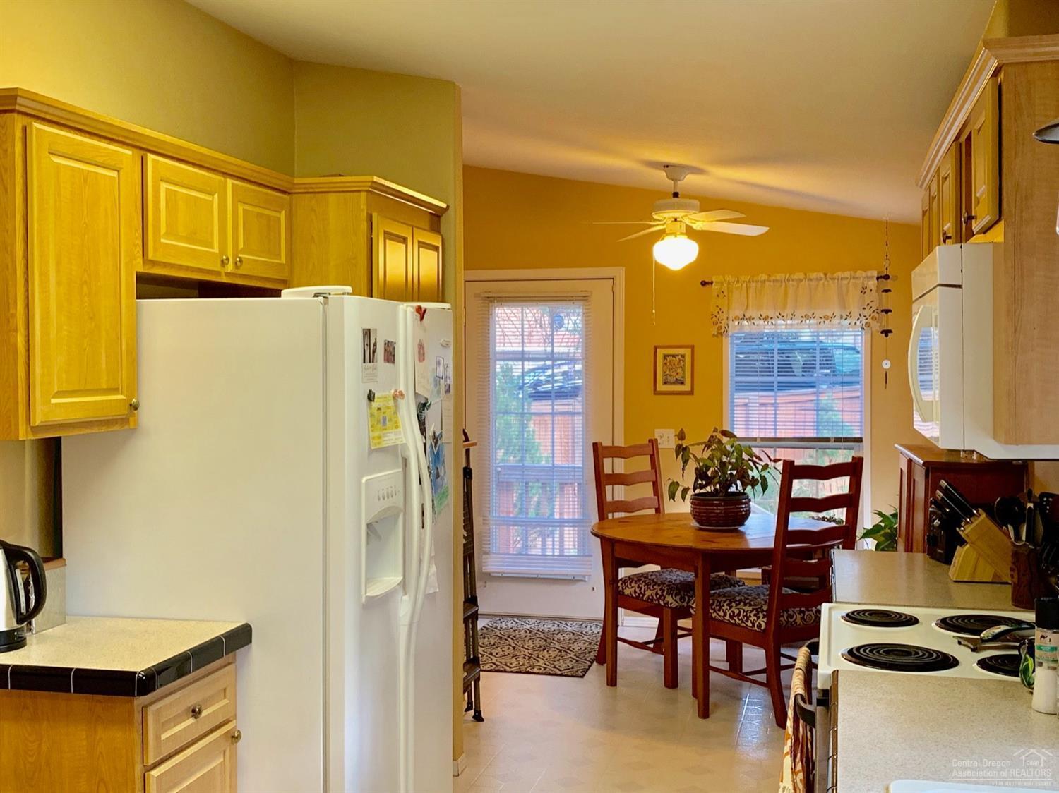 141 Southwest 15th Street, Unit 37 Bend, OR 97702 - Photo 5 of 23 Breakfast table with sunny windows