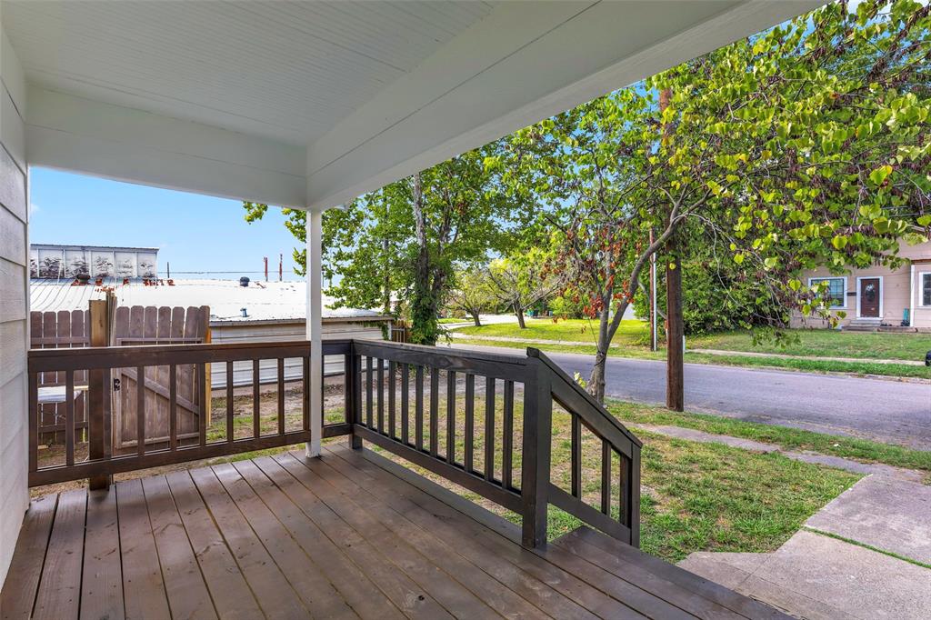 1005 North Neal Street Commerce, TX 75428 - Photo 4 of 23 a view of a balcony with trees