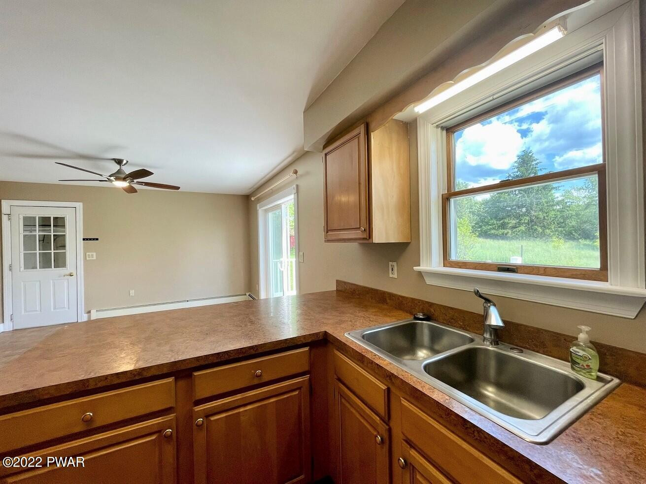 524 Creamton Drive Prompton, PA 18456 - Photo 14 of 57 a kitchen with a sink and large window