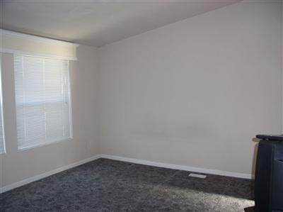 Large master bedroom with vaulted ceilings.