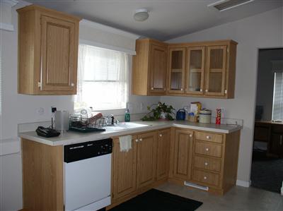 Light and bright over the kitchen sink.  More cabinets and drawers.