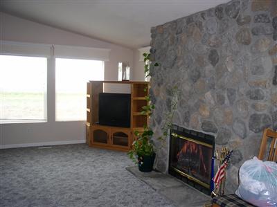 Huge family room with vaulted ceilings and a  gas fireplace.