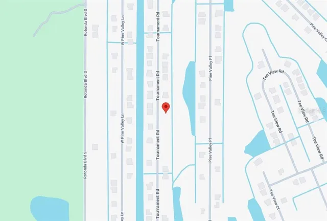 a view of a field with an trees