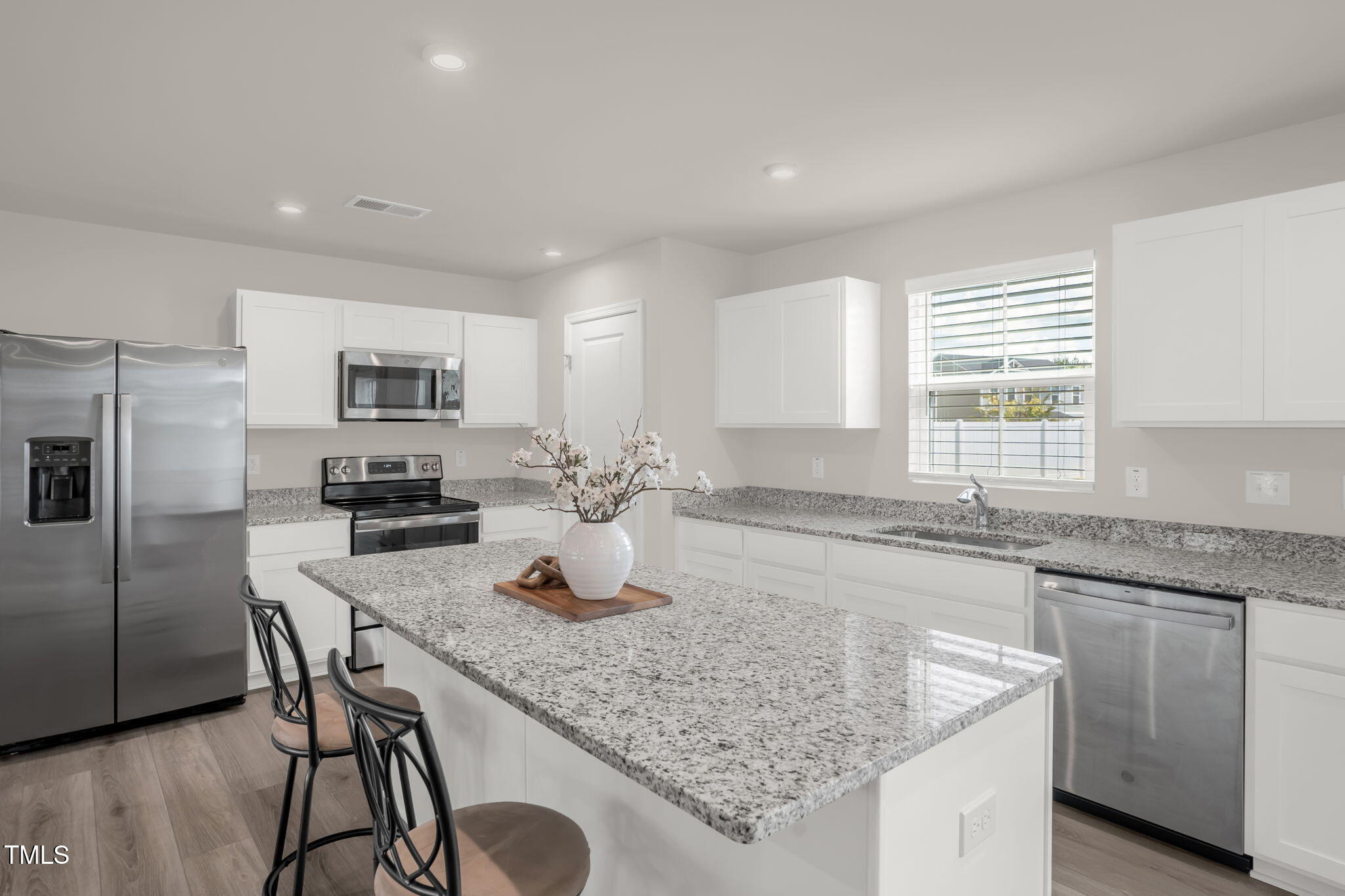801 Brook Bawn Road Wendell, NC 27591 - Photo 11 of 30 a kitchen with granite countertop kitchen island cabinets and appliances