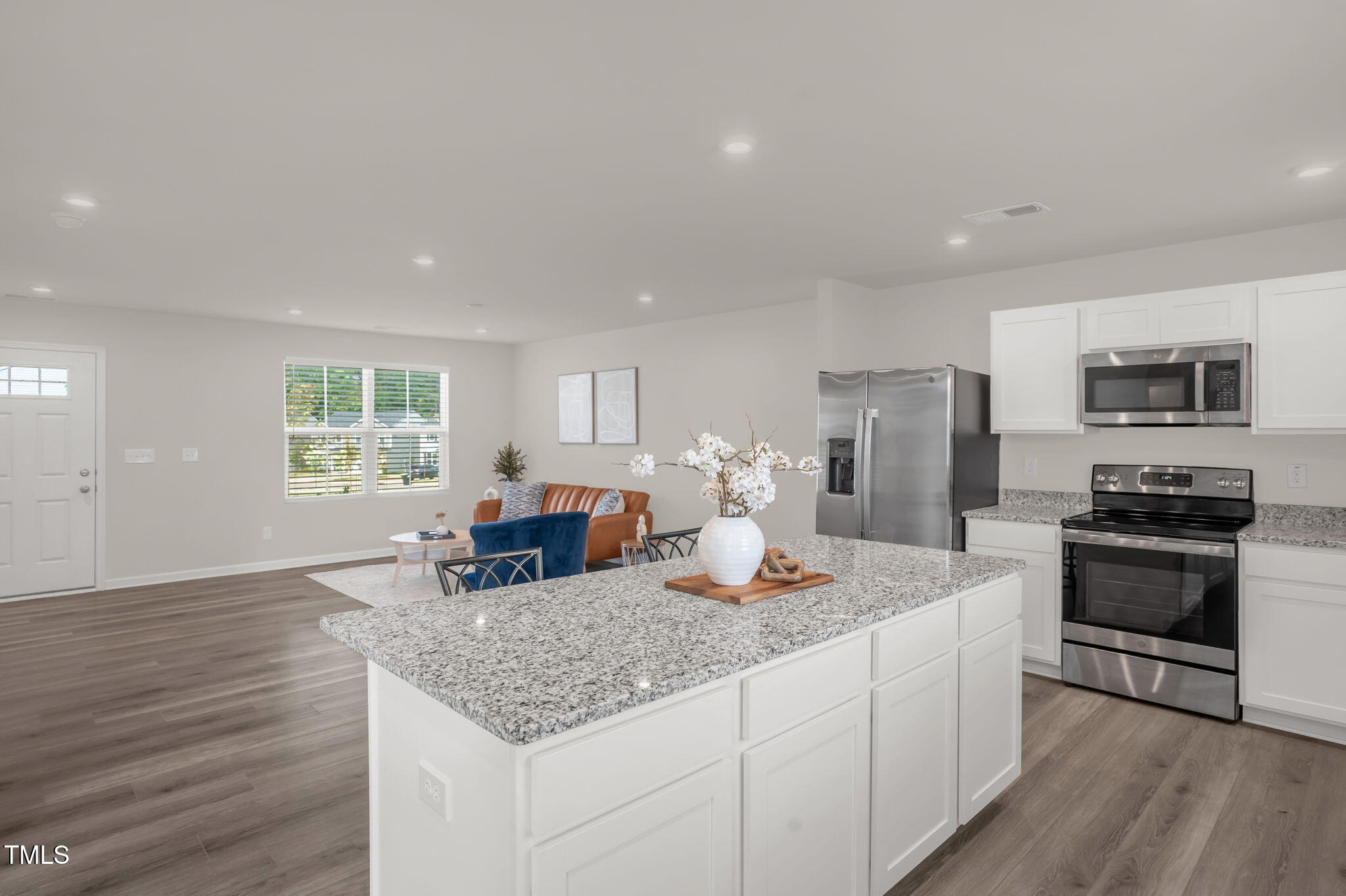 801 Brook Bawn Road Wendell, NC 27591 - Photo 12 of 30 a kitchen with stainless steel appliances granite countertop a sink stove and refrigerator
