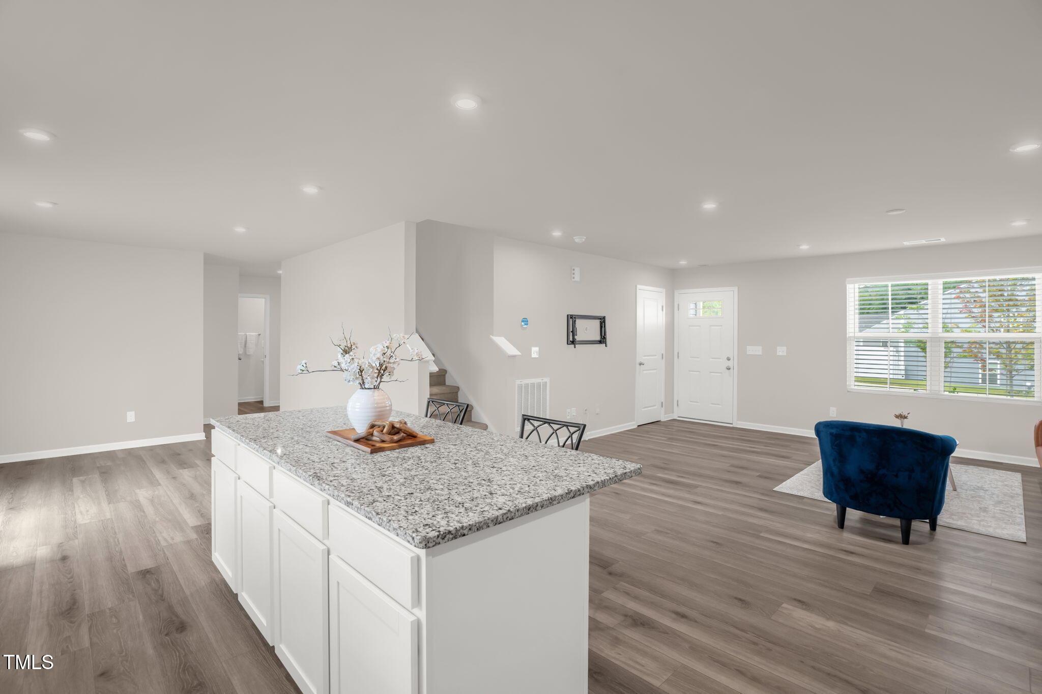 801 Brook Bawn Road Wendell, NC 27591 - Photo 13 of 30 a living room with kitchen island granite countertop wooden floor and a couch