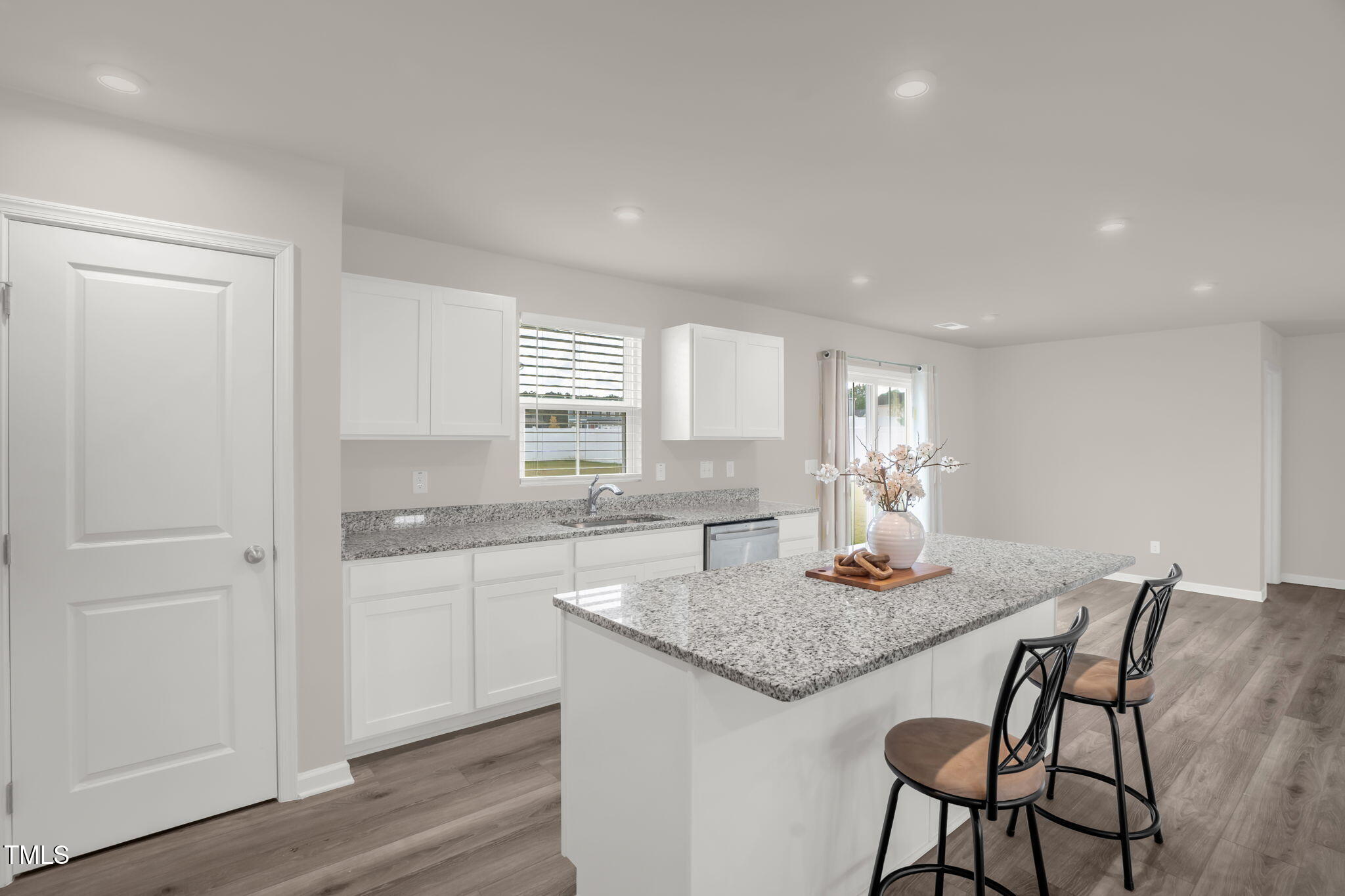 801 Brook Bawn Road Wendell, NC 27591 - Photo 14 of 30 a kitchen with granite countertop sink dining table and chairs
