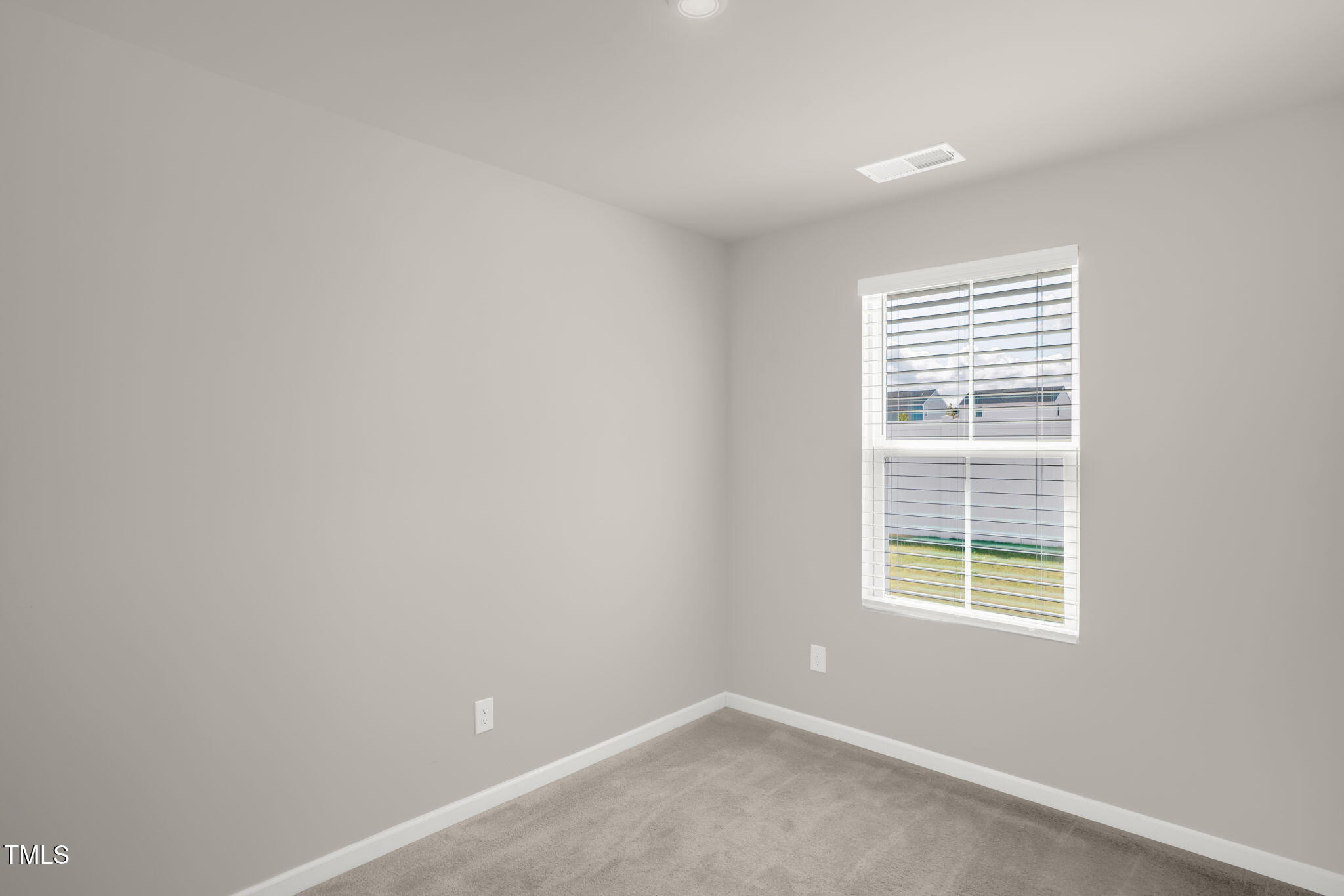 801 Brook Bawn Road Wendell, NC 27591 - Photo 16 of 30 an empty room with a window