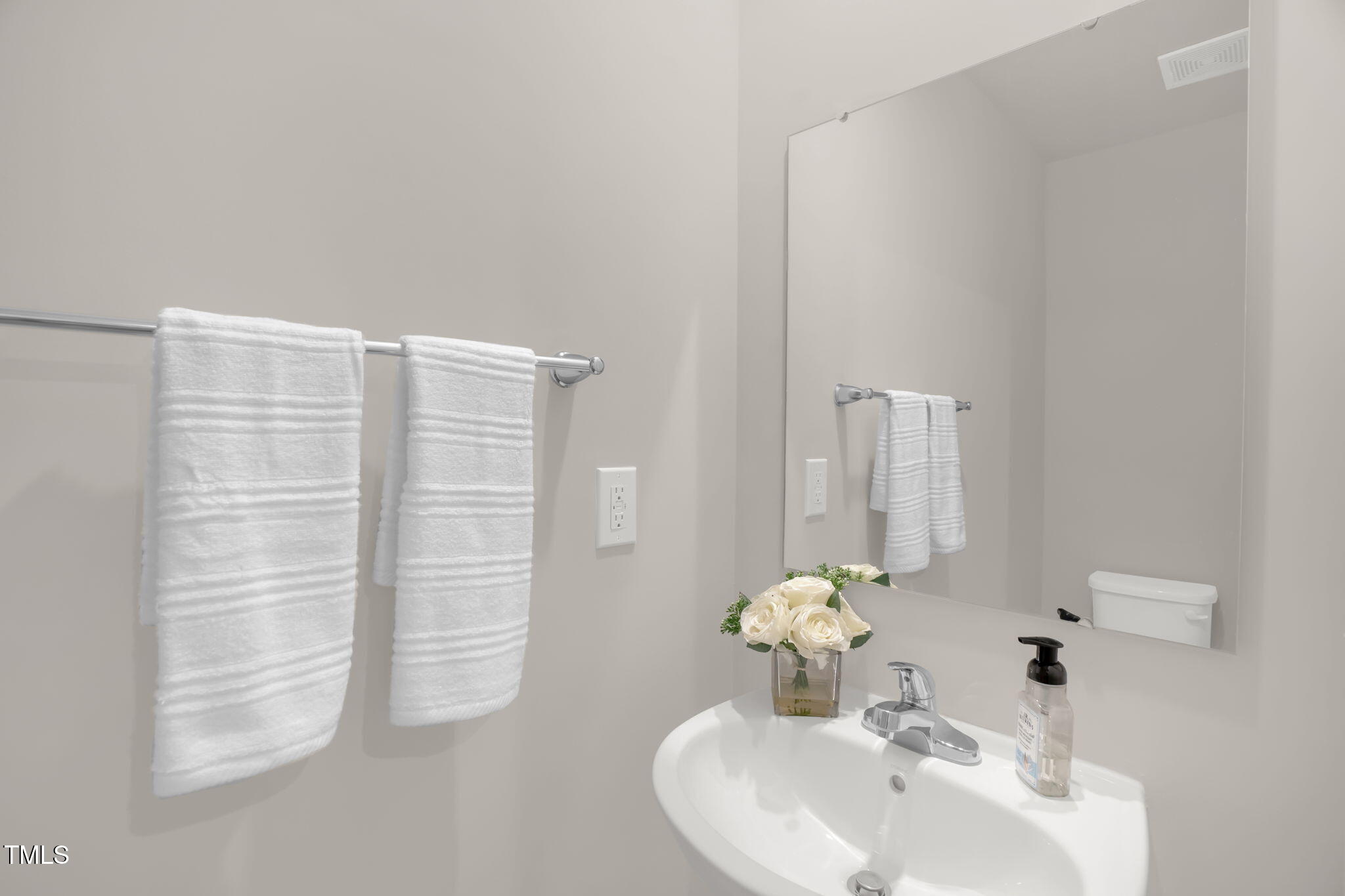 801 Brook Bawn Road Wendell, NC 27591 - Photo 17 of 30 a bathroom with a sink and a mirror