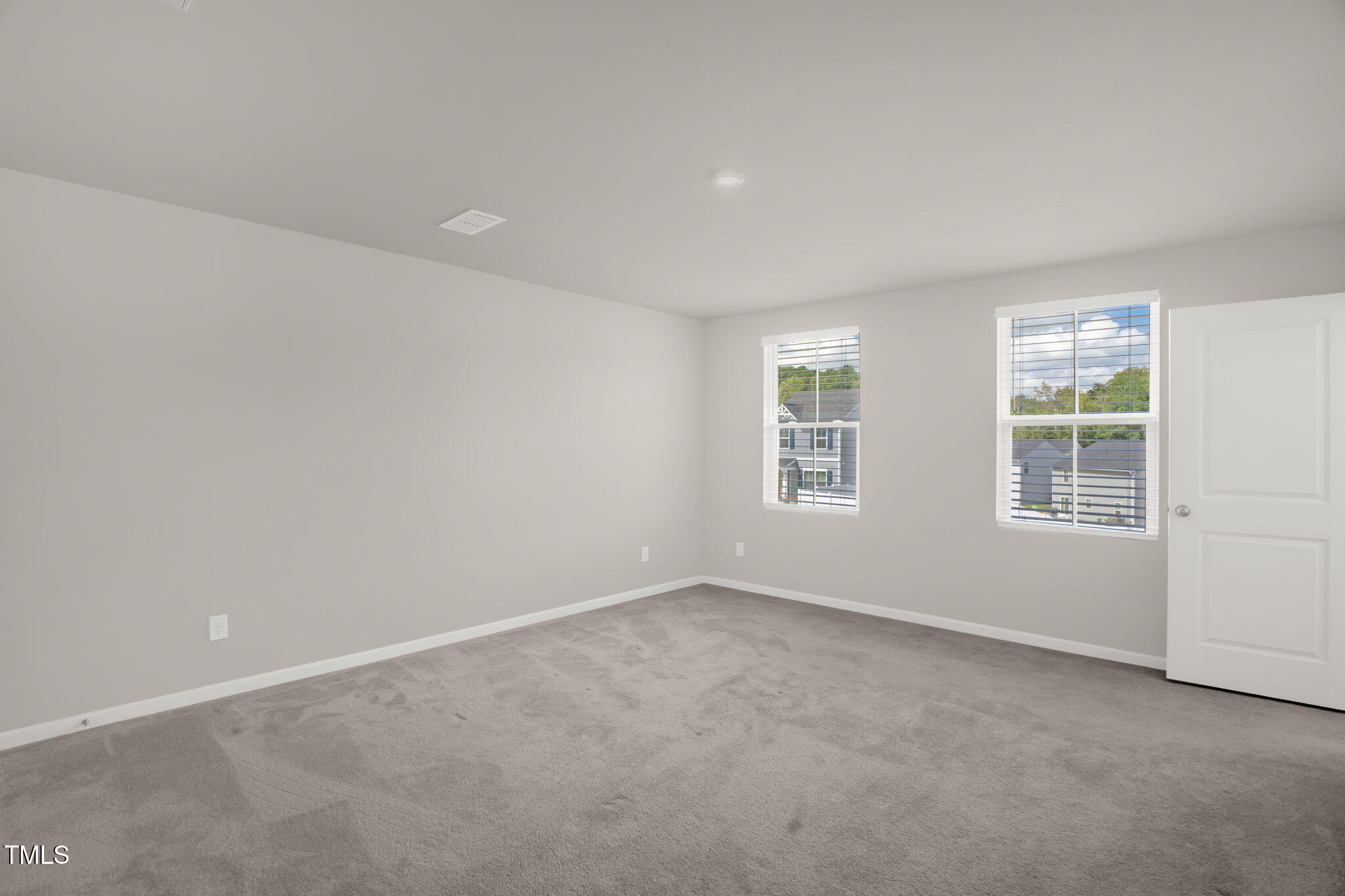 801 Brook Bawn Road Wendell, NC 27591 - Photo 18 of 30 an empty room with windows