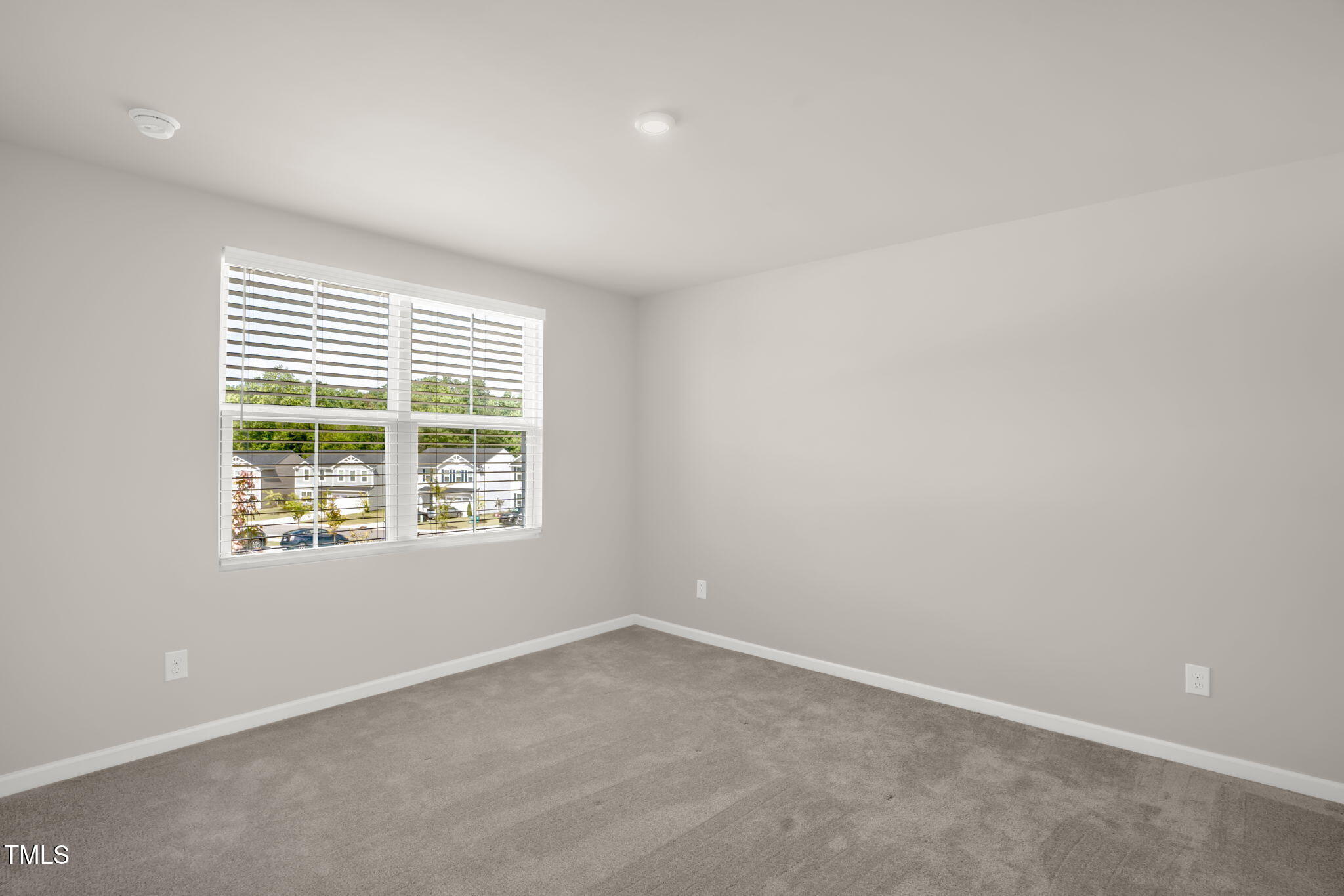 801 Brook Bawn Road Wendell, NC 27591 - Photo 21 of 30 an empty room with a window