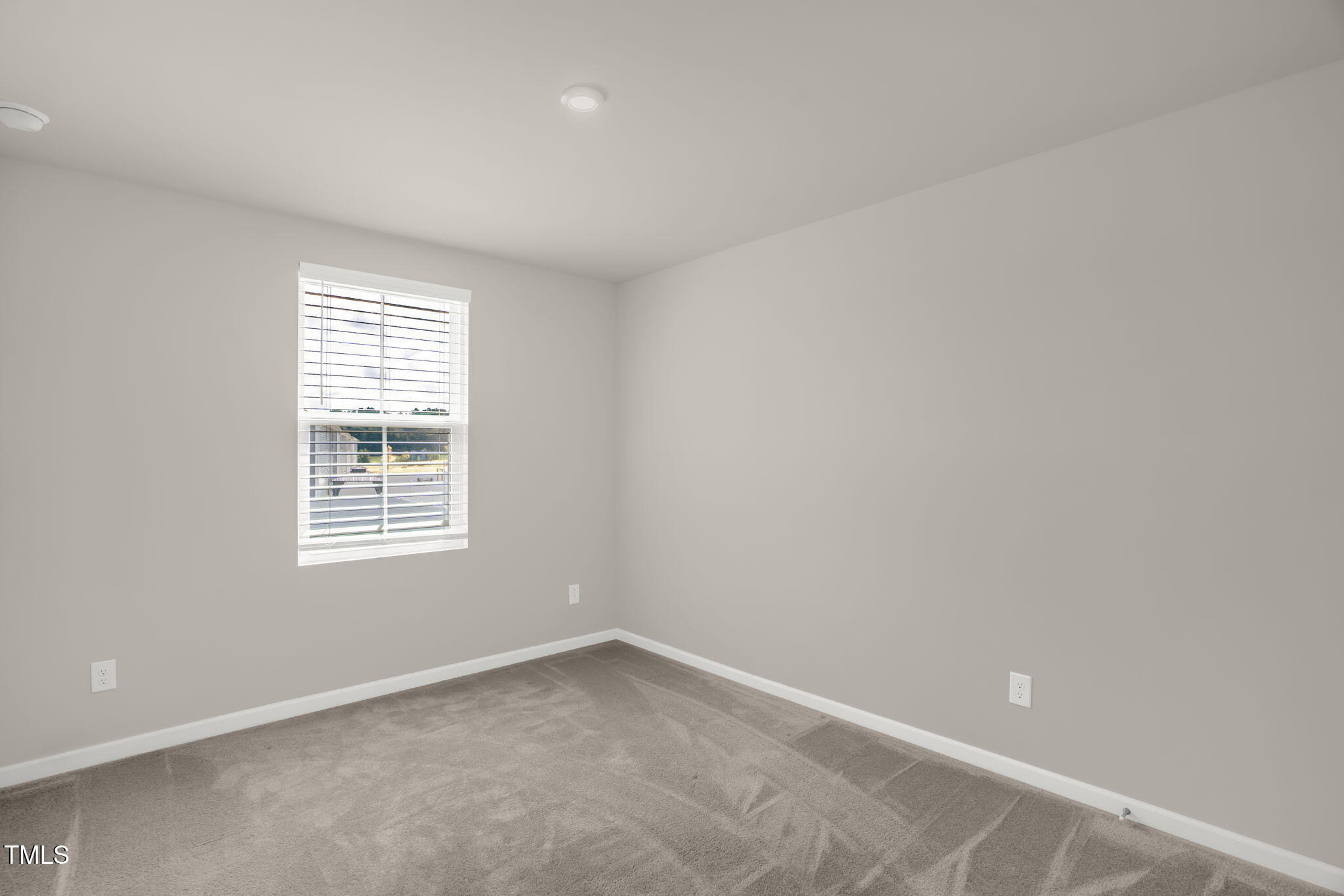 801 Brook Bawn Road Wendell, NC 27591 - Photo 25 of 30 an empty room with a window