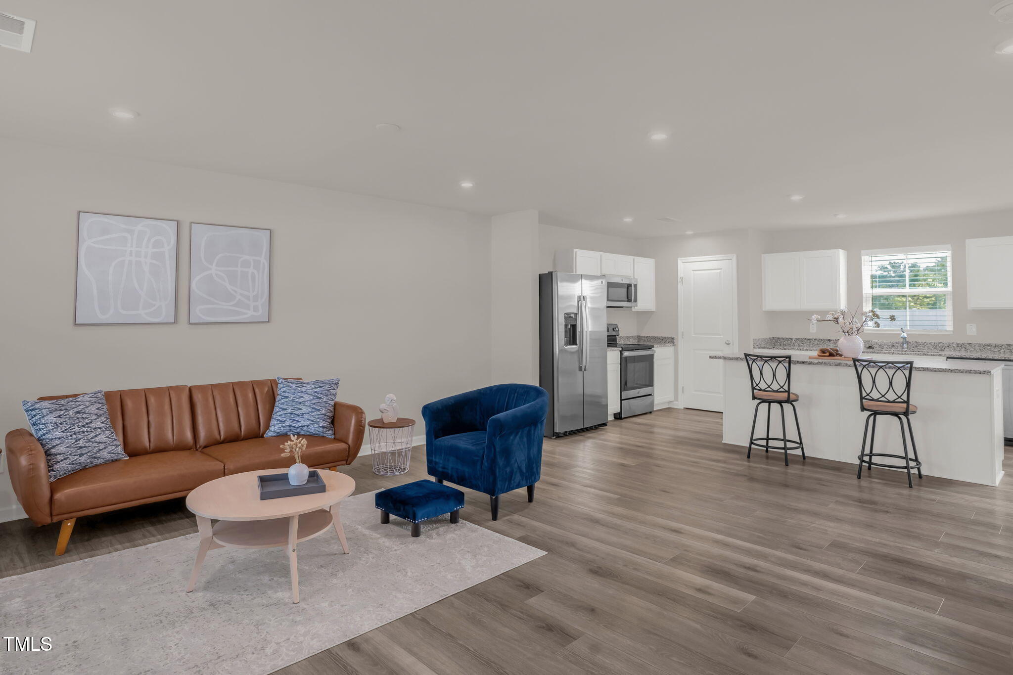 801 Brook Bawn Road Wendell, NC 27591 - Photo 6 of 30 a living room with furniture and kitchen view